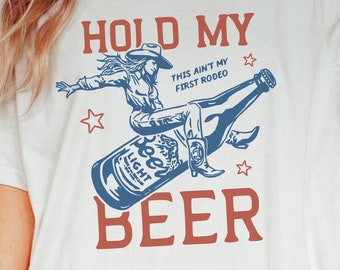 Hold My Beer T-Shirt – Funny Rodeo Cowboy Shirt – Bella Canvas Western Tee – This Ain’t My First Rodeo Shirt – Country Beer Lover Gift Tee