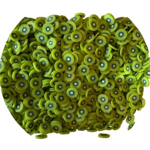 May include: A large collection of small, flat, circular slices resembling kiwi fruit. Each piece features a vibrant lime green outer ring, a lighter green inner circle, and a dark green center with radiating lines, mimicking the appearance of a sliced kiwi.
