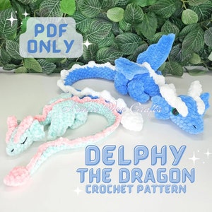 May include: PDF crochet pattern for a blue and green dragon amigurumi toy named Delphy the Dragon. The pattern includes instructions for crocheting the dragon's body, wings, and tail.