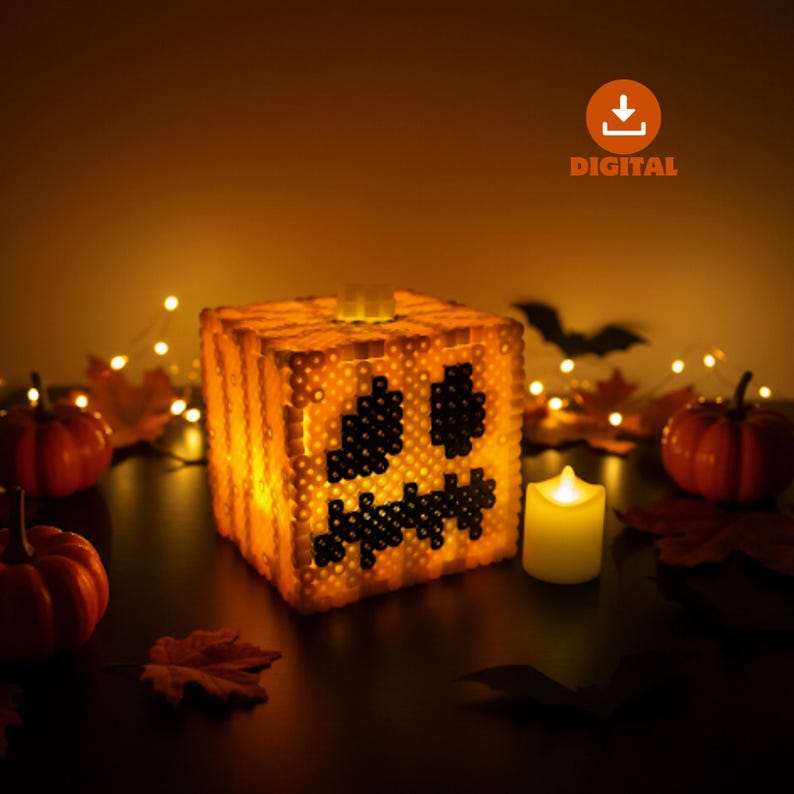 May include: A glowing orange cube-shaped Halloween decoration with a jack-o'-lantern face made of black beads. A small candle and miniature pumpkins are nearby. The word "DIGITAL" is in the upper right corner.