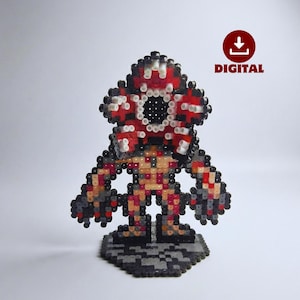 Könnte beinhalten: Eine Pixel-Art-Figur des Demogorgon, hergestellt aus bunten Perlen. Die Figur hat ein rot-weiß-schwarzes Farbschema mit detailliertem Kopf und Körper. Das Wort "DIGITAL" wird neben einem Download-Symbol angezeigt.