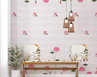 May include: A white wall with a pink and white chevron pattern. The wall is decorated with pink lotus flowers and two white cows with their calves. The cows are standing on a light brown wooden bench.