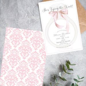 May include: A pink and white damask pattern wedding invitation with the text "She's Tying the Knot!" and details for a bridal shower for Alicia Brittba on March 16th, 2024 at 3 PM at The Royal Palace.