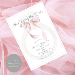 May include: A white and pink watercolor illustration of a ring with a bow on top. The text "She's Tying the Knot!" is at the top of the invitation. The invitation is for a bridal shower for Alicia Britton on March 16th, 2024 at 5 PM at The Royal Palace. The RSVP information is at the bottom of the invitation.