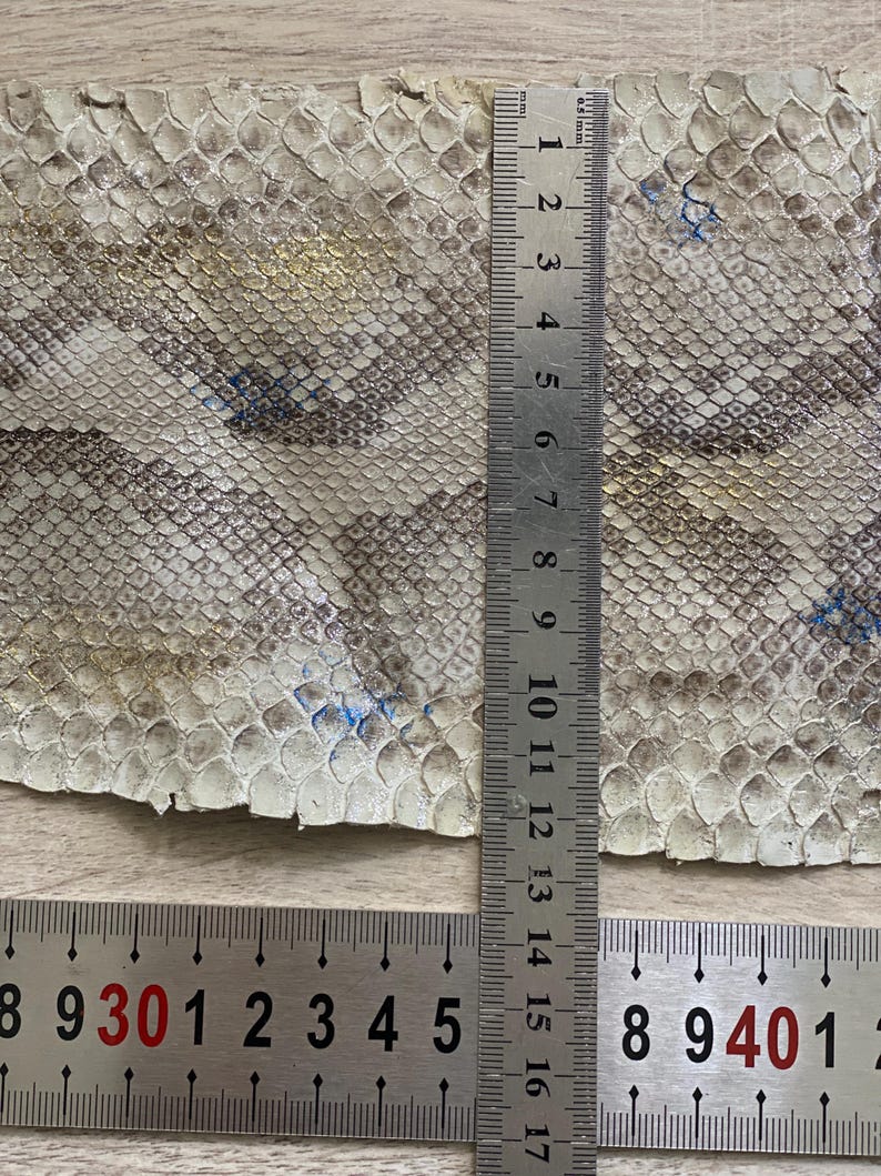 Natural color snake skin fabric with authentic reptile scale pattern