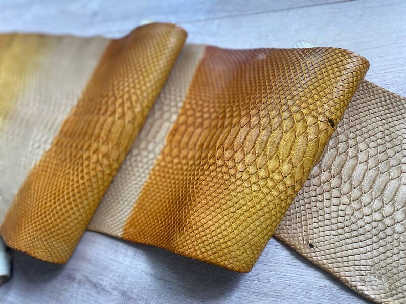 Premium exotic leather with smooth cream to amber color transition