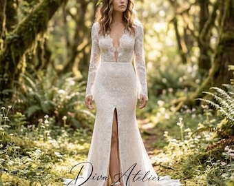 May include: A floor-length white lace gown with long sleeves, a deep V-neckline, and a front slit. The dress features intricate floral lace patterns throughout the fabric. A floral crown is worn on the head. The text Diva Atelier is visible.