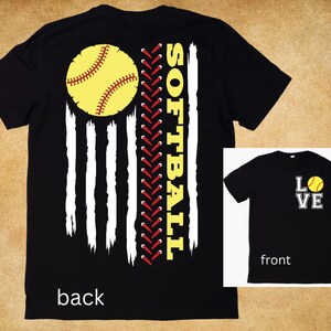 May include: Black t-shirt with a softball and American flag design on the back. The front of the shirt says "Love" with a softball graphic.