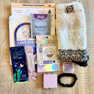 May include: A selection of sleep aids, including fluffy socks, lavender-infused products, earplugs, and a hair tie. The items are arranged on a wooden surface, with text that reads "Breathing Techniques" and "Bedtime".