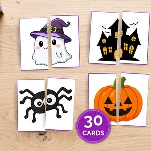 May include: A set of 30 Halloween-themed matching cards featuring split illustrations of a ghost wearing a purple hat, a black haunted house, a black spider, and an orange jack-o'-lantern pumpkin, all with purple borders on a white background.