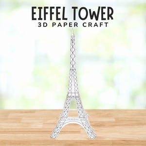 May include: A 3D paper craft of the Eiffel Tower, a famous landmark in Paris, France. The model is white and has a detailed, openwork design. The text "EIFFEL TOWER 3D PAPER CRAFT" is displayed above the model.