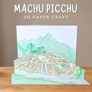 May include: A 3D paper craft model of Machu Picchu featuring hand-colored illustrations of stone structures and mountains in shades of green, yellow, and blue. The text "MACHU PICCHU 3D PAPER CRAFT" is printed in white at the top of the display.