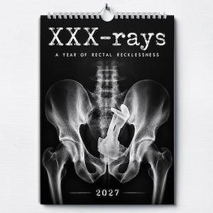 May include: A 2027 wall calendar with a black background featuring a white X-ray image of a human pelvis containing a foreign object. The text reads XXX-rays A YEAR OF RECTAL RECKLESSNESS at the top and 2027 at the bottom in white lettering.