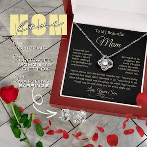 May include: A silver necklace with a knot pendant and a message card that reads "To My Beautiful Mom". The card includes a heartfelt message about the love and appreciation for a mother. The necklace comes with a matching pair of earrings and a mahogany gift box. Free shipping is included.