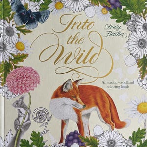 May include: A coloring book titled "Into the Wild" by Daisy Fletcher. The cover features a detailed illustration of a fox, squirrel, and butterfly, surrounded by flowers and foliage. The book is described as "An exotic woodland coloring book."