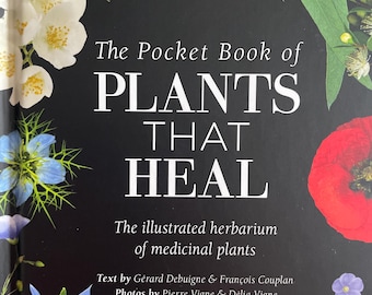 May include: A book titled "The Pocket Book of Plants That Heal" with a black cover. The cover is decorated with colorful flowers, including pink, white, red, and blue blooms. The book is an illustrated herbarium of medicinal plants.