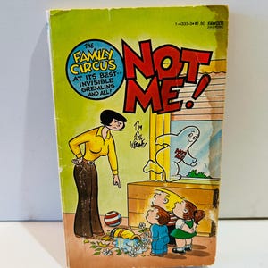 May include: A vintage comic book titled "Not Me!" featuring a cartoon family. The cover has a yellow background with the title in red and white. The Family Circus logo is in a blue circle. The illustration shows a woman pointing at a window with children.