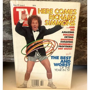 May include: A magazine cover featuring Richard Simmons, a well-known fitness personality, with the title "Here Comes Richard Simmons...and his amazing rolling, crying, shouting, sweating, incredibly profitable diet show!"  The cover also includes the text "Plus The Best and Worst of the Year in TV".