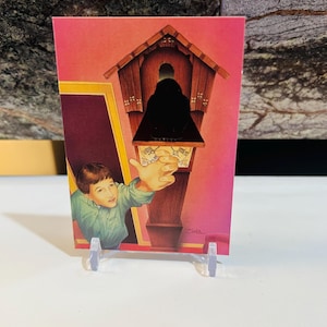 May include: A vintage postcard featuring a boy reaching towards a cuckoo clock. The clock is brown with intricate details, set against a pink background with yellow and burgundy accents. The boy is wearing a green shirt. The artist's signature, "Zina," is visible.