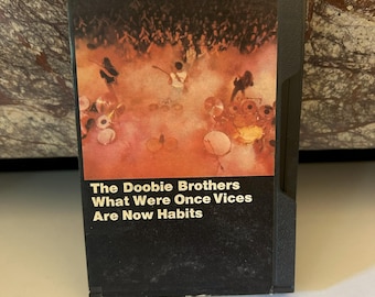 Doobie Brothers 1974 Cinta de casete negra Lo que alguna vez fueron vicios ahora son hábitos