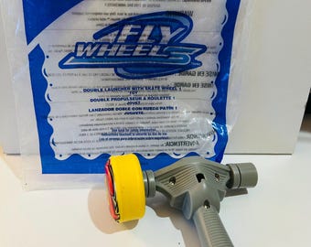 Fly Wheels - Lanzador doble con patín de juguete