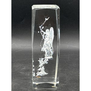 May include: A white ceramic mug with a black handle and the text "But First, Coffee" in a black, bold font. The mug is on a white surface.