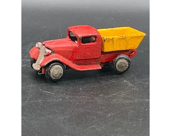 Antique/Vintage cast-iron painted red and yellow articulated dump truck