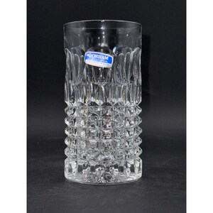 May include: A clear glass drinking glass with a cut glass design. The glass has a label that reads "GORHAM Crystal by Gorham".