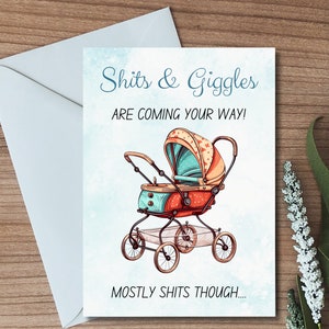 May include: A humorous baby shower card with a cartoon illustration of a vintage baby stroller. The card reads "Shits & Giggles are coming your way! Mostly shits though..."