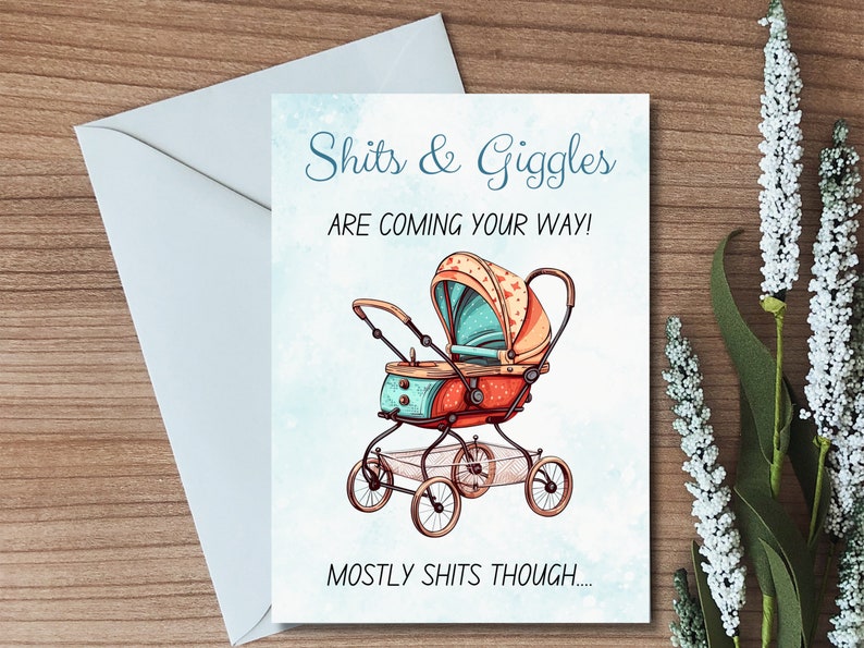 May include: A humorous baby shower card with a cartoon illustration of a vintage baby stroller. The card reads "Shits & Giggles are coming your way! Mostly shits though..."