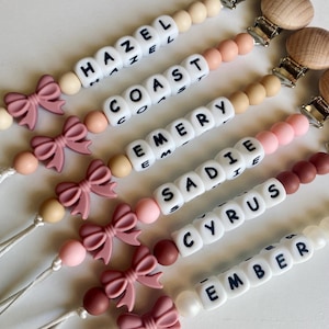 Mauve Bow Personalized Pacifier Clip with White Letter Beads