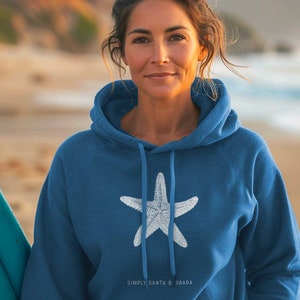 May include: A blue hooded sweatshirt with a white starfish design and the text "SIMPLY SANTA BARBARA" on the bottom.