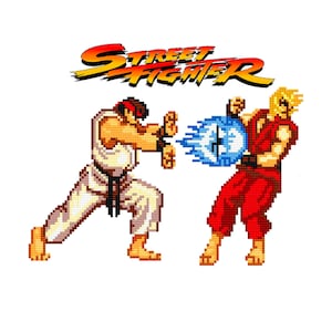 May include: A pixelated image of two characters from the video game Street Fighter. The character on the left is wearing a white gi and a red headband. The character on the right is wearing a red gi and has blonde hair. The character on the left is throwing a blue energy blast at the character on the right.