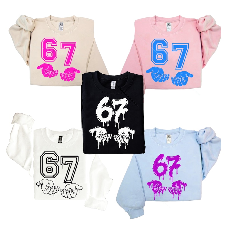 May include: A collection of sweatshirts in various colors, including beige, pink, black, white, and light blue. Each sweatshirt features the number "67" and a hand graphic. The designs are in different colors, such as pink, blue, and white.