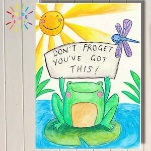May include: A hand-painted greeting card featuring a cheerful green frog holding a sign that reads "DON'T FROGET YOU'VE GOT THIS!". The card includes a smiling sun, a dragonfly, and the words "PDF PRINTABLE GREETING CARD HAND PAINTED DESIGN" on a tag.