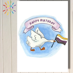 May include: A hand-painted birthday card with a white goose holding a non-binary pride flag. The goose is depicted against a blue backdrop, with a banner reading "Happy Birthday". The card is a printable greeting card.