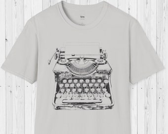 May include: A gray t-shirt with a black and white illustration of a vintage typewriter on the front.