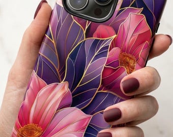 May include: A smartphone case featuring a vibrant floral pattern with large pink and magenta flowers set against deep purple leaves. The design is accented with thin, elegant gold outlines that define the petals and foliage, creating a sophisticated look.
