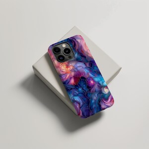 May include: A phone case with a colorful abstract design featuring swirling patterns in shades of blue, purple, pink, and white. The design resembles a galaxy or nebula.