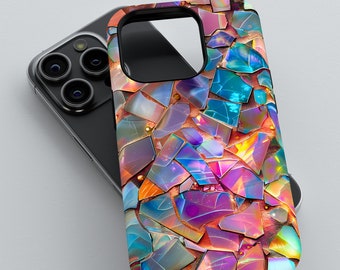 May include: A smartphone case with a mosaic design. The case features a pattern of iridescent, irregularly shaped pieces in shades of blue, purple, orange, and yellow. The case is shown on top of a black smartphone.