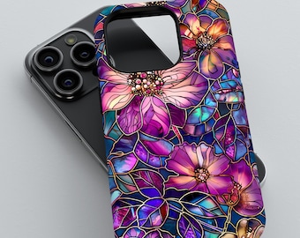 May include: A phone case featuring a stained-glass floral design. The case showcases a vibrant arrangement of purple, pink, and blue flowers with gold outlines. The design is set against a dark background, creating a striking contrast.