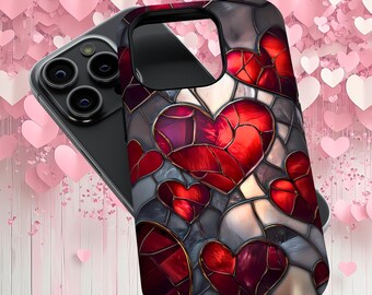 Puede incluir: Una funda de teléfono negra con un diseño de vitral con corazones rojos, morados y dorados.