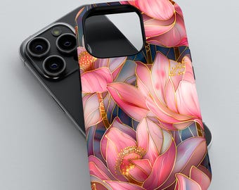 May include: A pink and gold floral phone case with a detailed design of pink lotus flowers. The case is designed for a smartphone with a camera bump.
