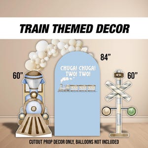 May include: Train themed party decorations featuring a blue and brown train cutout, a blue and white train sign with the text "CHUGA! CHUGA! TWO! TWO!" and a white and brown railway crossing sign. The train cutout is 60 inches tall, the sign is 84 inches tall, and the railway crossing sign is 60 inches tall.