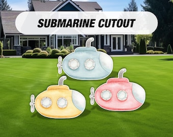 May include: Three colorful submarine cutouts in light blue, yellow, and pink, each with a white conning tower, portholes, and a propeller. The text "SUBMARINE CUTOUT" is displayed above the submarines.