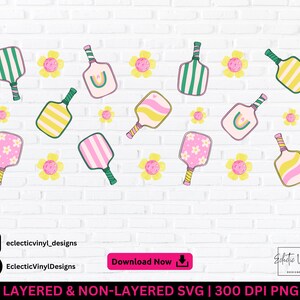 May include: A digital design with pickleball paddles and flowers on a white brick background. The paddles are in various colours and patterns. The text "LAYERED & NON-LAYERED SVG | 300 DPI PNG" is at the bottom of the image.