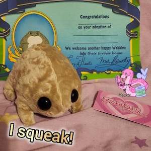 May include: A rustic wooden sign with the text "Welcome to our home" in white lettering. The sign features a distressed finish and a simple, inviting design, perfect for a front porch or entryway.