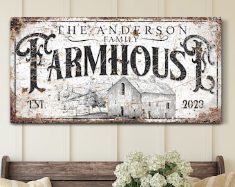 May include: A rustic farmhouse sign with the text "THE ANDERSON FAMILY FARMHOUSE EST. 2023" in black lettering. The sign features a distressed, vintage design with a barn illustration. The sign is displayed above a wooden bench with pillows and a basket of flowers.