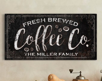 May include: Black and white sign with the text "Fresh Brewed Coffee Co. The Miller Family" in a vintage style font.