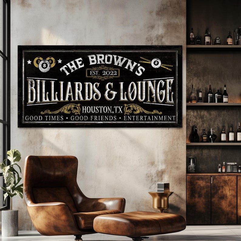 May include: Black and gold sign with the text "The Brown's Billiards & Lounge, Est. 2022, Houston, TX, Good Times, Good Friends, Entertainment".